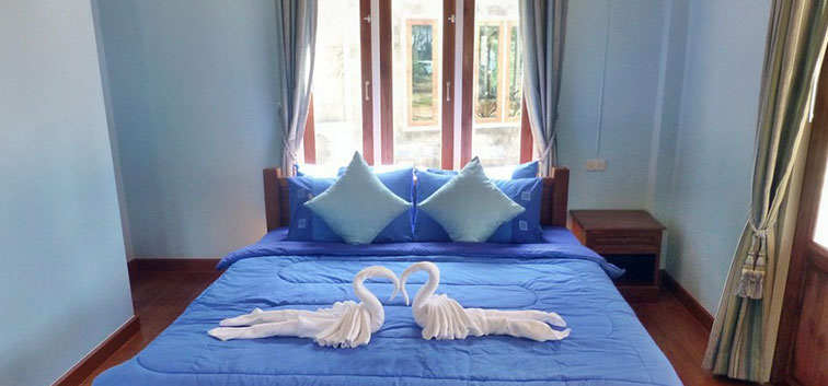 Coconut Garden Deluxe Bungalows bed