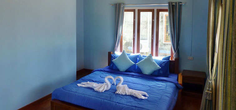 Coconut Garden Deluxe Bungalows towels on bed
